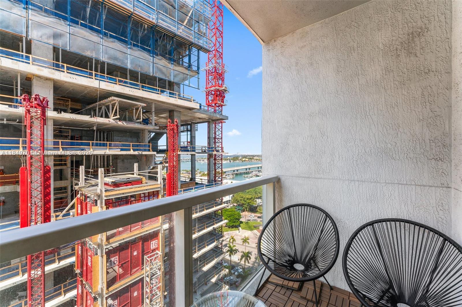 244 Biscayne Boulevard, Unit 1808 Miami, FL 33132 - Photo 9 of 18 a view of entryway with a lots of frames on the wall