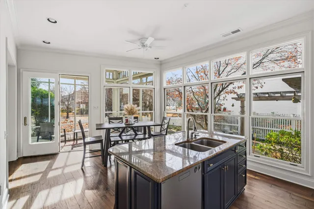 a kitchen with granite countertop a sink and a table