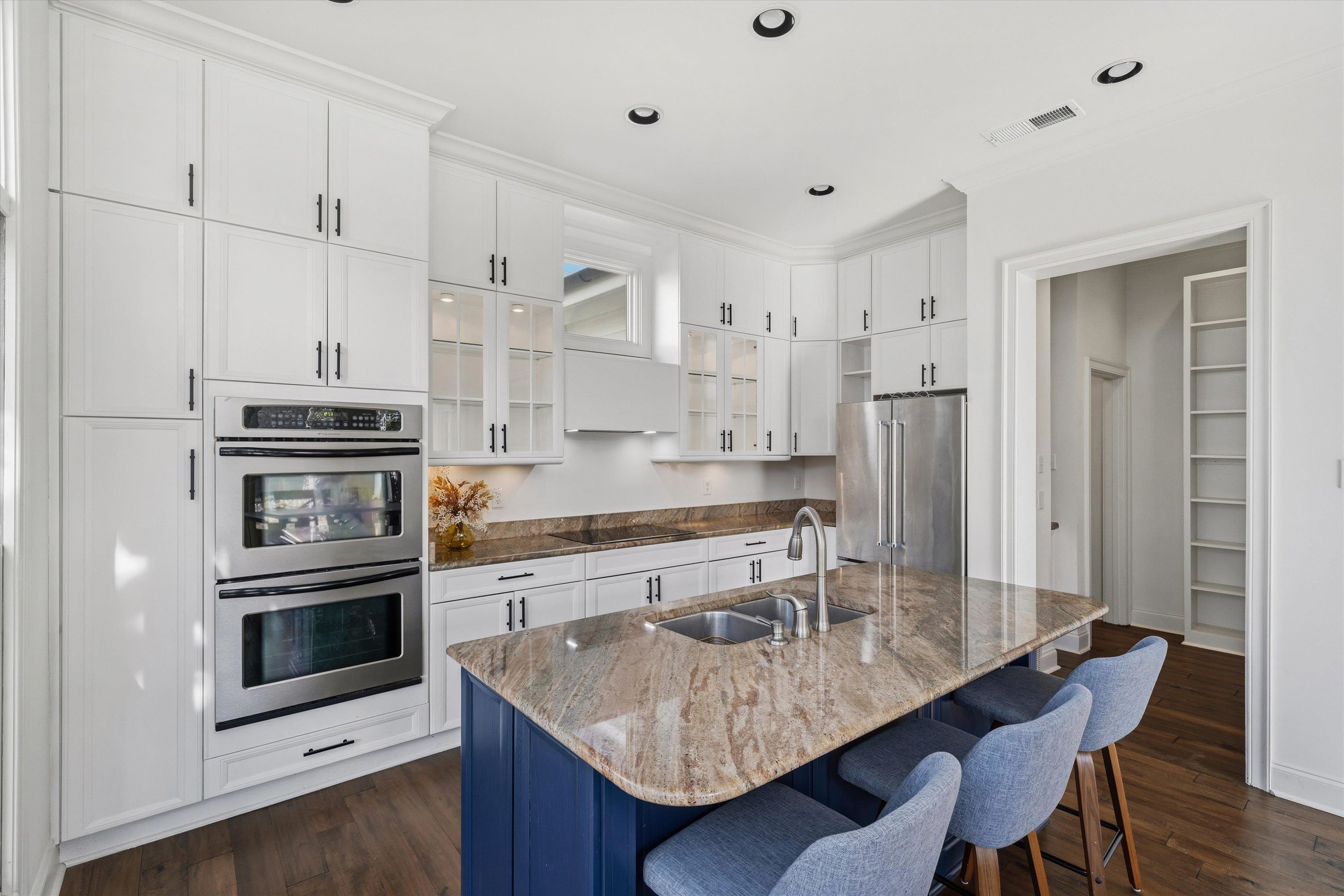 837 Harbor Bend Road Memphis, TN 38103 - Photo 10 of 35 a kitchen with stainless steel appliances granite countertop a stove a refrigerator a sink a dining table and chairs