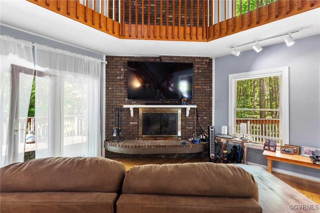 13320 Berkeley Road Orange, VA 22960 - Photo 12 of 46 a living room with furniture a flat screen tv and a fireplace