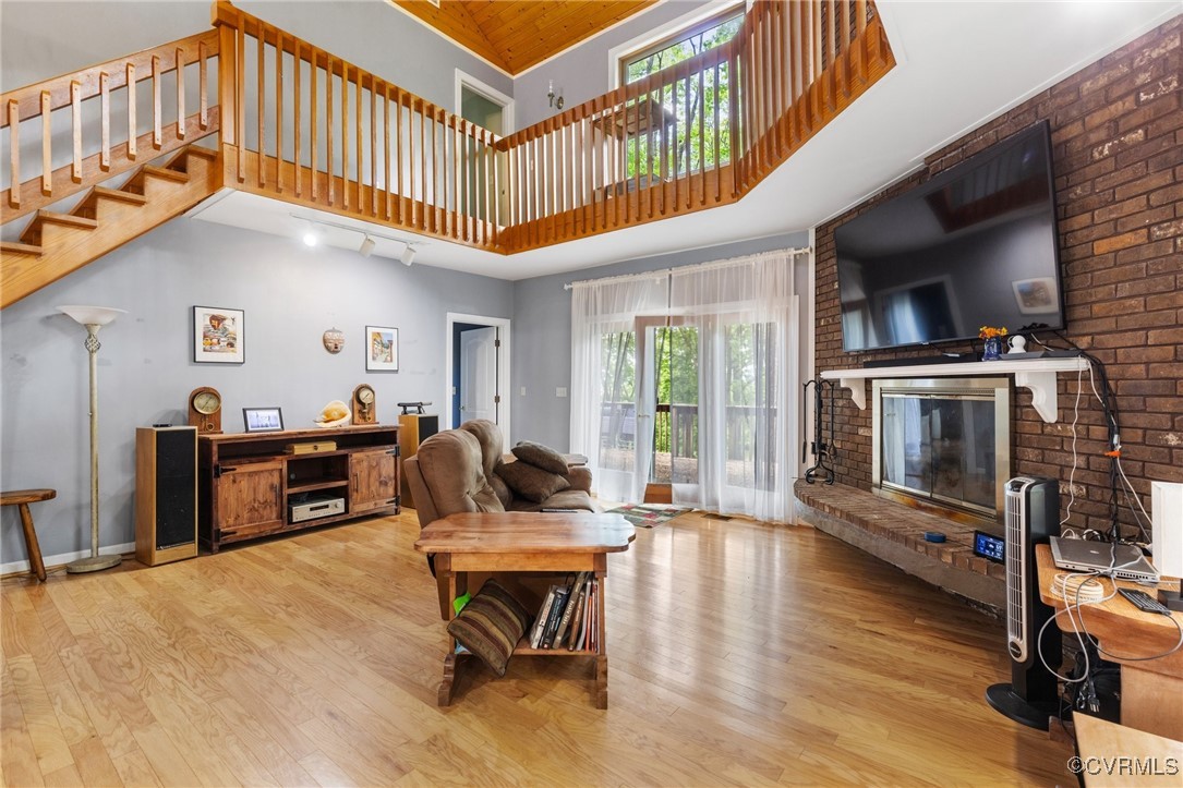 13320 Berkeley Road Orange, VA 22960 - Photo 20 of 46 a living room with furniture a fireplace and a flat screen tv