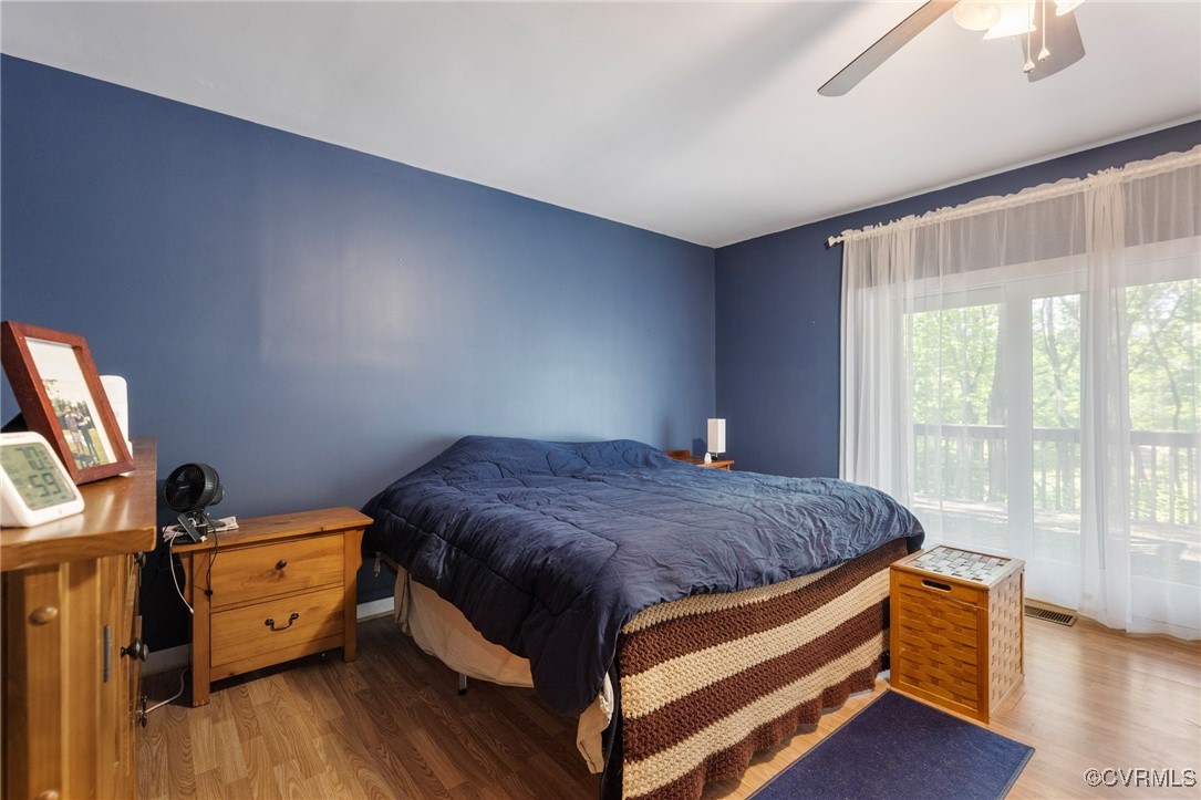 13320 Berkeley Road Orange, VA 22960 - Photo 22 of 46 a bedroom with a bed and wooden floor