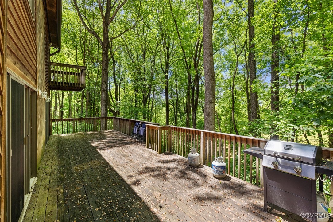 13320 Berkeley Road Orange, VA 22960 - Photo 36 of 46 a view of deck with two trees and wooden fence