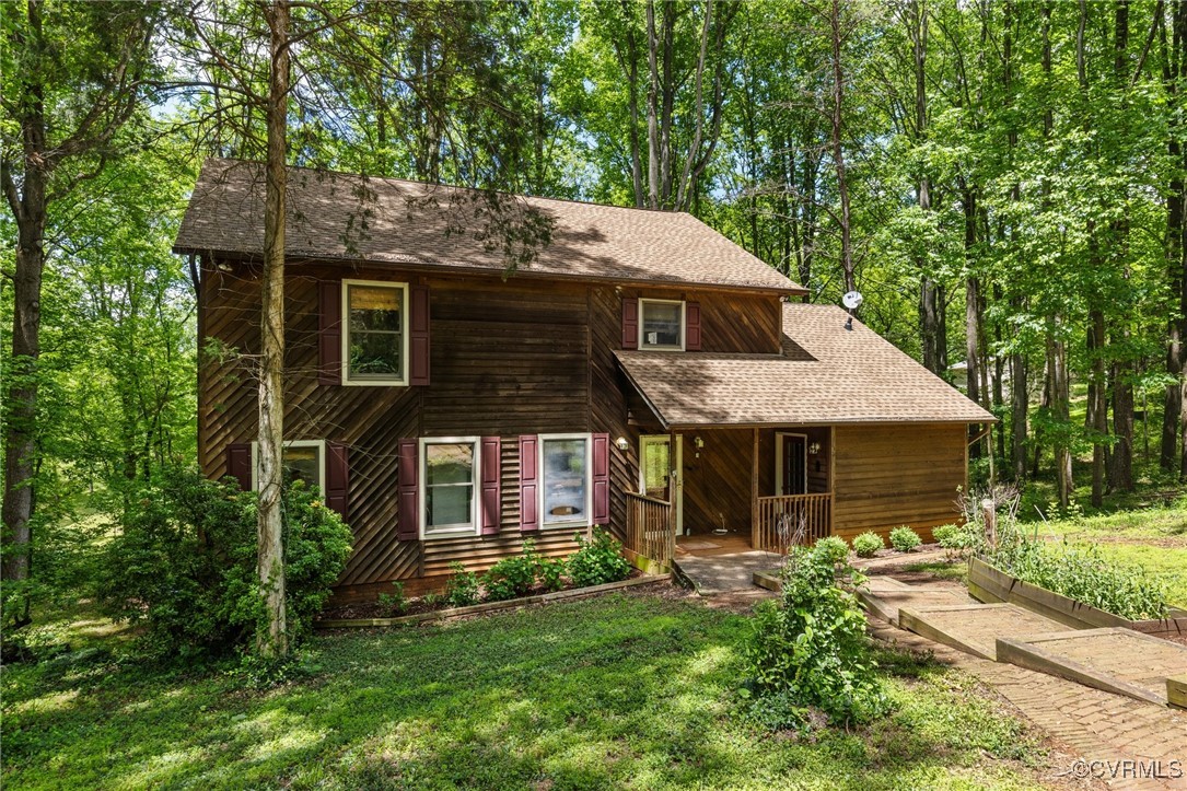 13320 Berkeley Road Orange, VA 22960 - Photo 5 of 46 a front view of a house with a garden