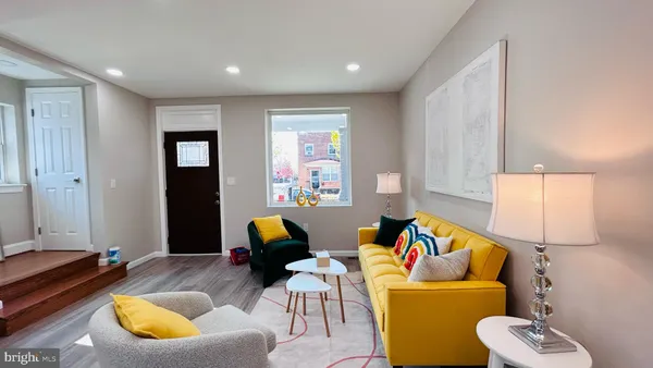 a living room with furniture and window