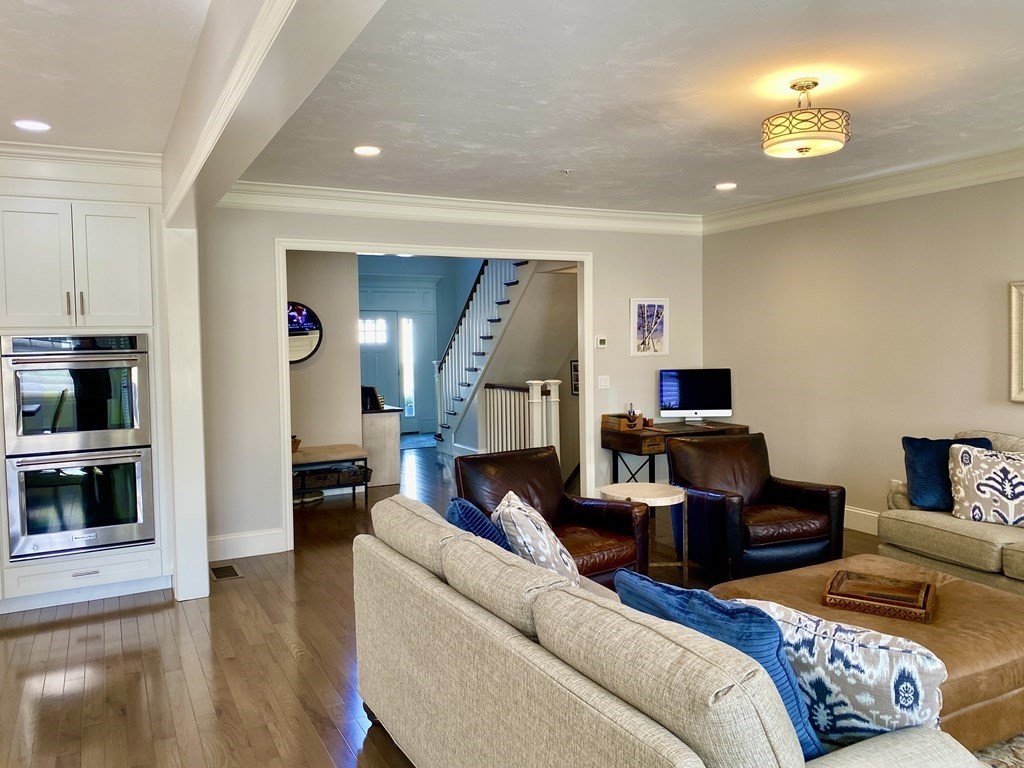 72 Brookview Road, Unit 72 Franklin, MA 02038 - Photo 11 of 29 a living room with furniture and a fireplace