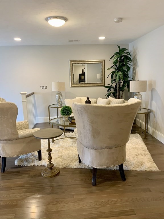 72 Brookview Road, Unit 72 Franklin, MA 02038 - Photo 13 of 29 a living room with furniture and a potted plant