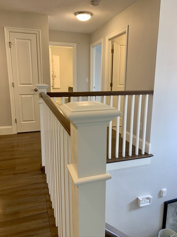 72 Brookview Road, Unit 72 Franklin, MA 02038 - Photo 17 of 29 a view of a hallway with wooden floor and staircase