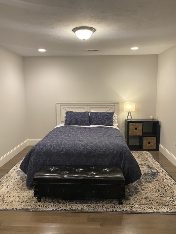 72 Brookview Road, Unit 72 Franklin, MA 02038 - Photo 20 of 29 a room with a bed and a television