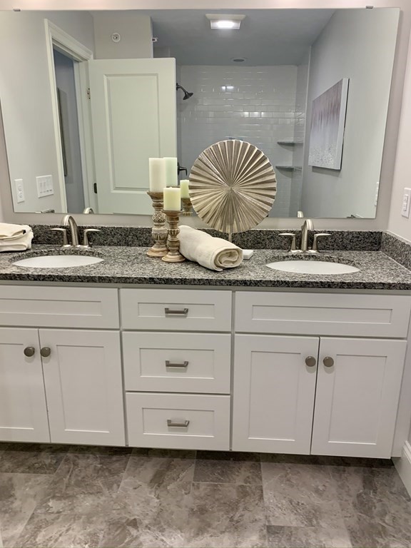 72 Brookview Road, Unit 72 Franklin, MA 02038 - Photo 22 of 29 a bathroom with a sink and a mirror