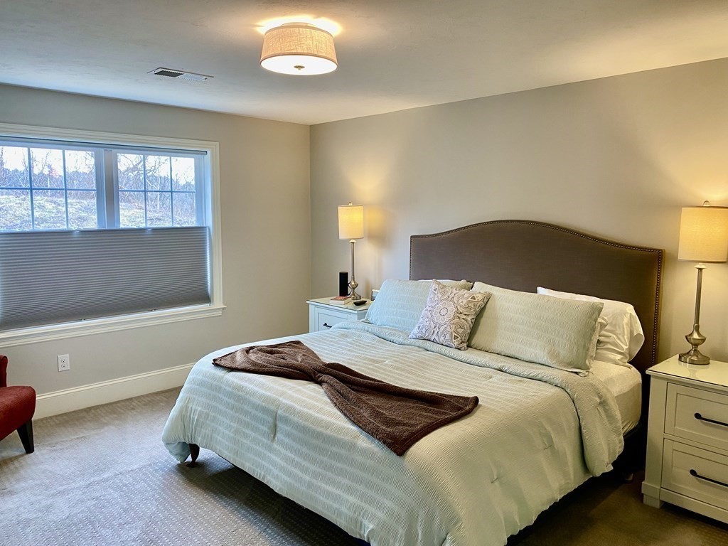 72 Brookview Road, Unit 72 Franklin, MA 02038 - Photo 23 of 29 a bedroom with a bed and a window