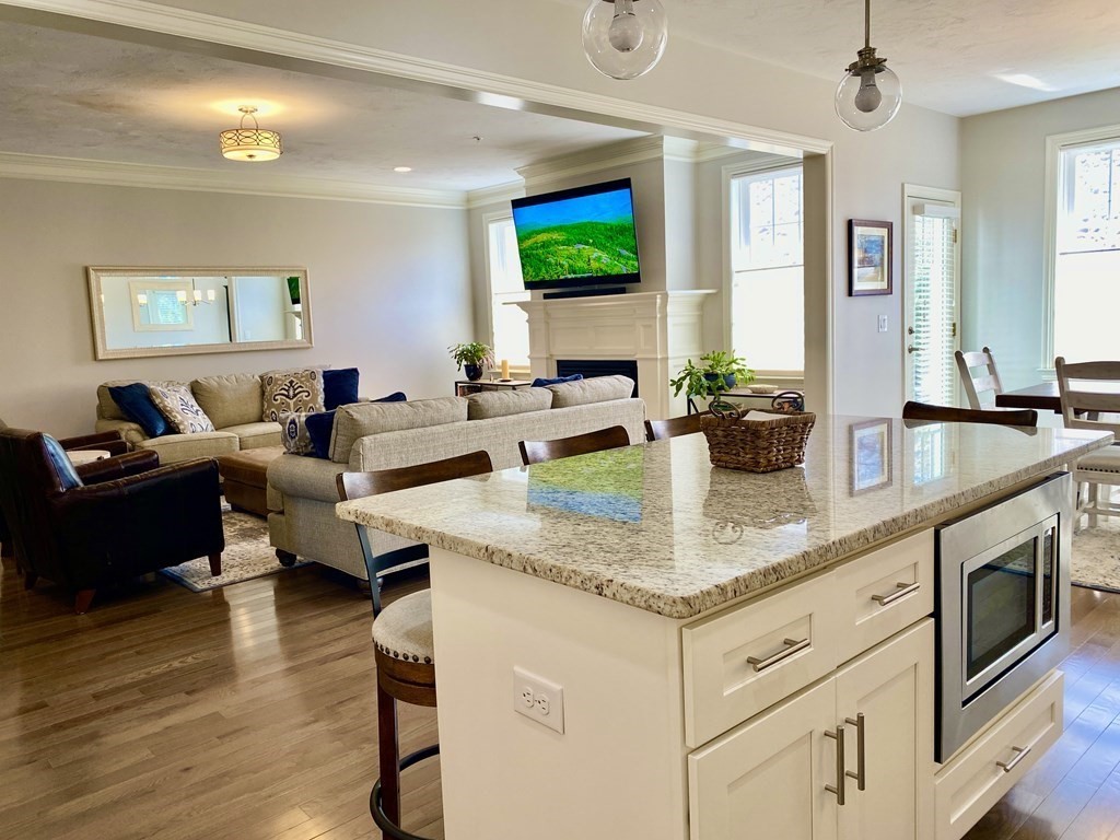 72 Brookview Road, Unit 72 Franklin, MA 02038 - Photo 6 of 29 a view of living room with granite countertop furniture and fireplace