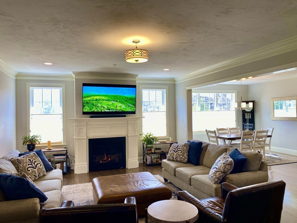 72 Brookview Road, Unit 72 Franklin, MA 02038 - Photo 8 of 29 a living room with furniture and a fireplace
