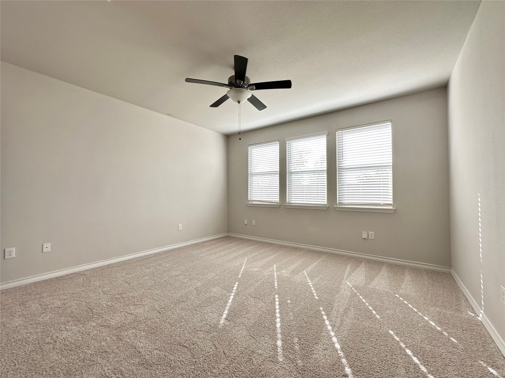 11604 Roxburgh Pass Manor, TX 78653 - Photo 13 of 40 a view of an empty room with a window