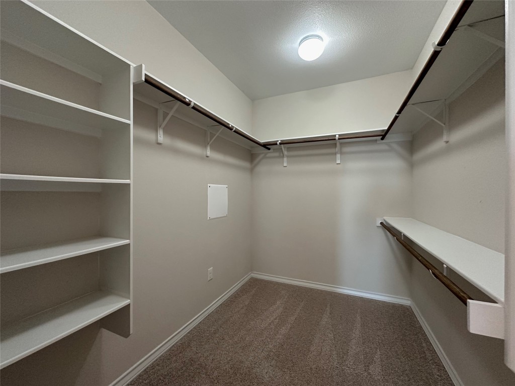 11604 Roxburgh Pass Manor, TX 78653 - Photo 17 of 40 a view of an empty walk in closet