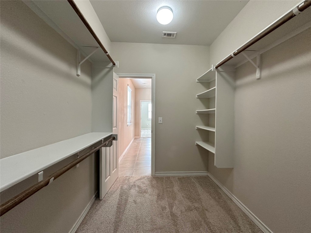 11604 Roxburgh Pass Manor, TX 78653 - Photo 18 of 40 a view of an empty walk in closet