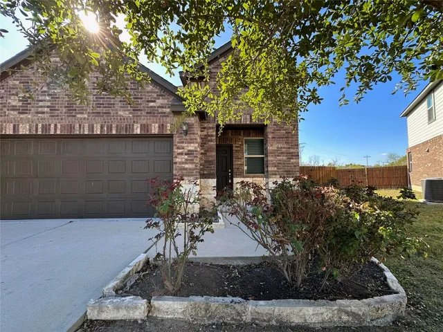 a view of a house with a tree