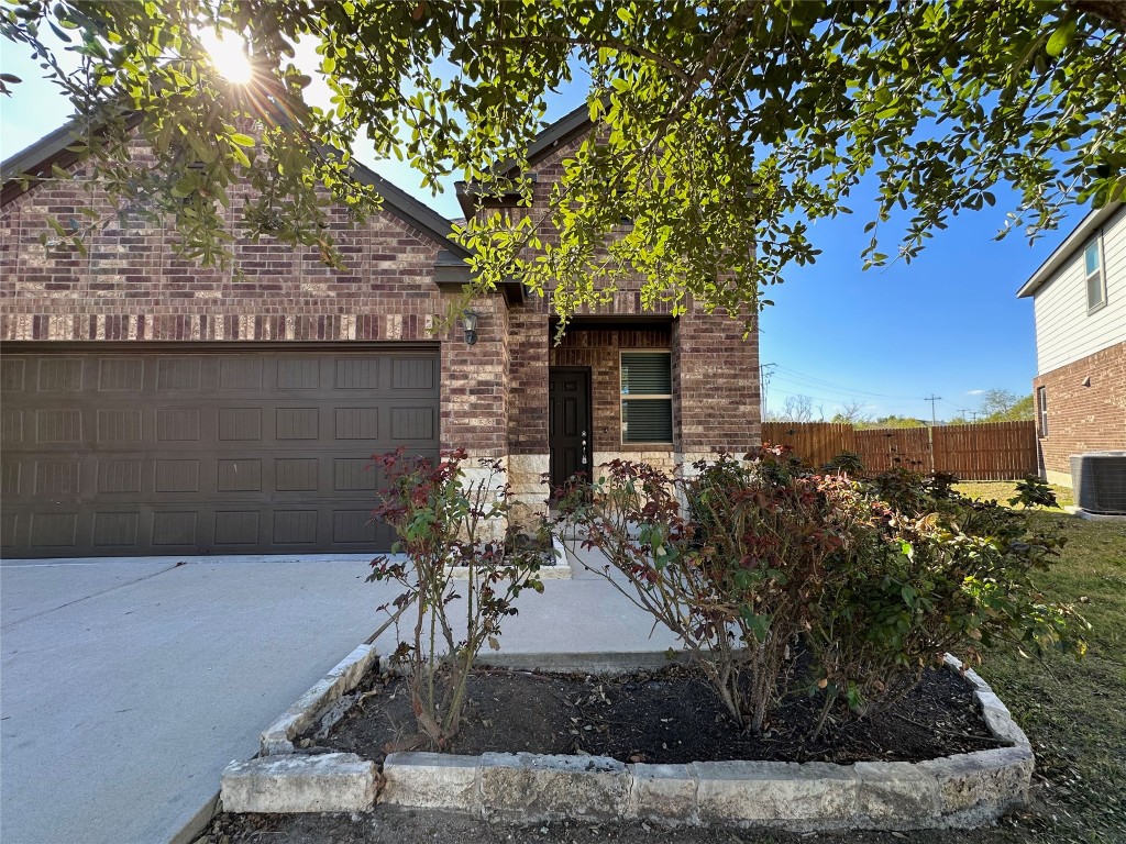 11604 Roxburgh Pass Manor, TX 78653 - Photo 2 of 40 a view of a house with a tree