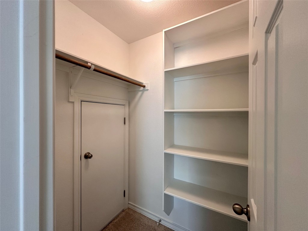 11604 Roxburgh Pass Manor, TX 78653 - Photo 33 of 40 a view of an empty walk in closet