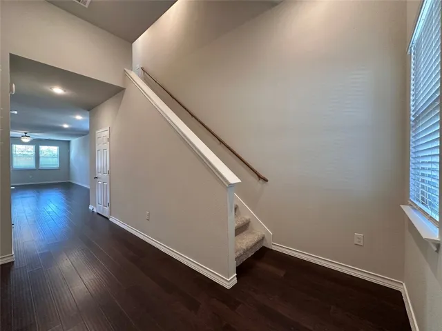 a view of entryway with wooden floor