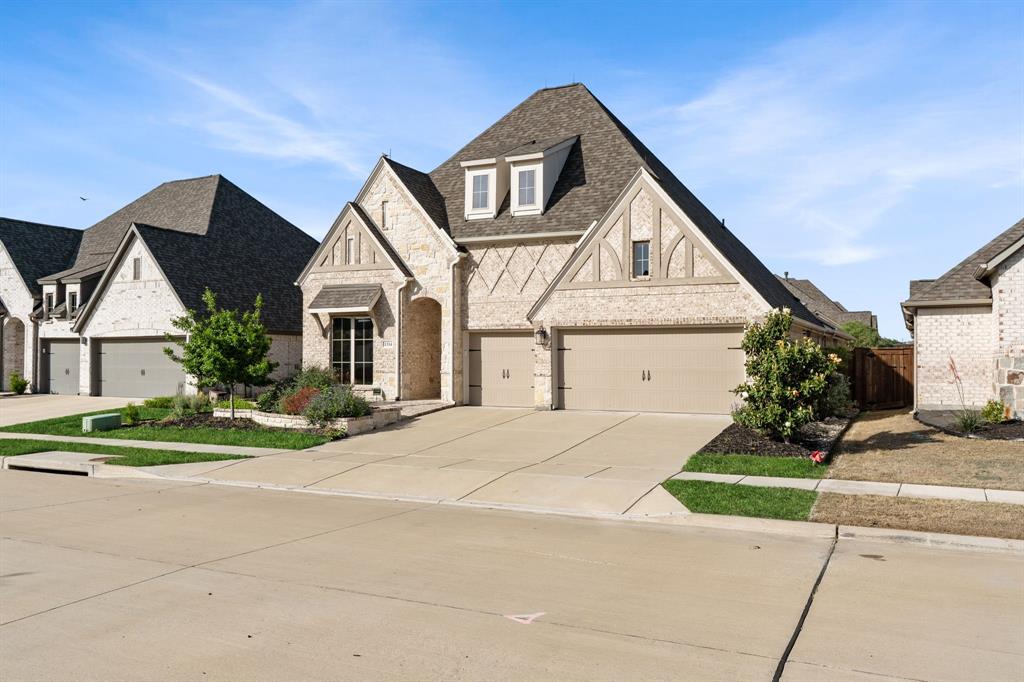1314 Buttermere Street Forney, TX 75126 - Photo 1 of 32 a front view of a house with a yard and garage