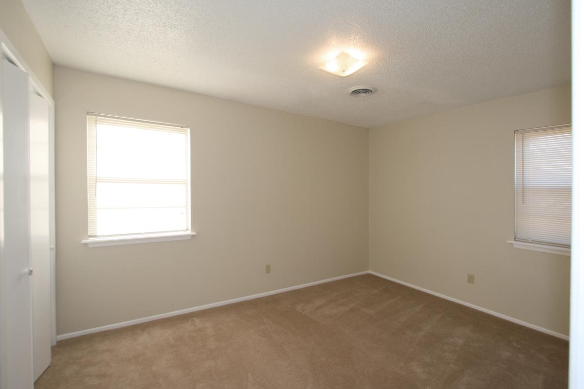 5137 Kirk Drive Amarillo, TX 79110 - Photo 5 of 12 an empty room with a window