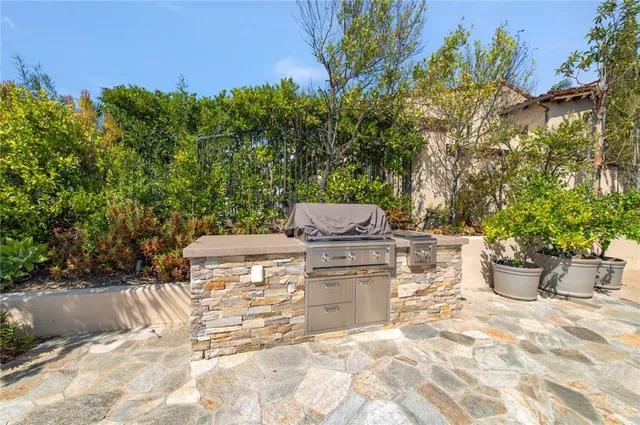 a view of a backyard with sitting area