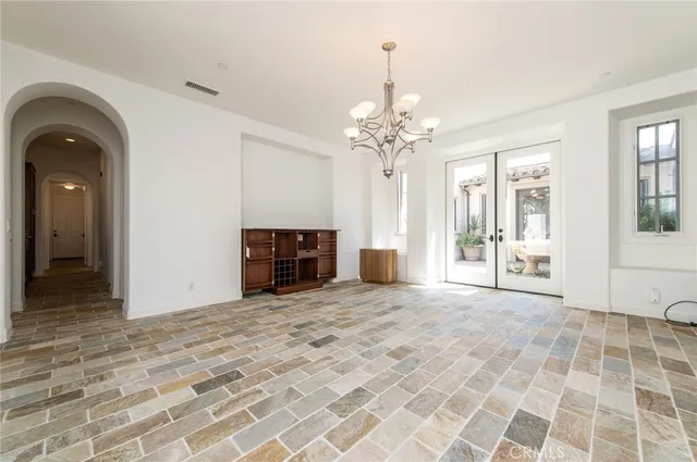 a view of empty room with a fireplace