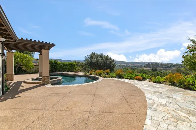 a view of a swimming pool with a patio