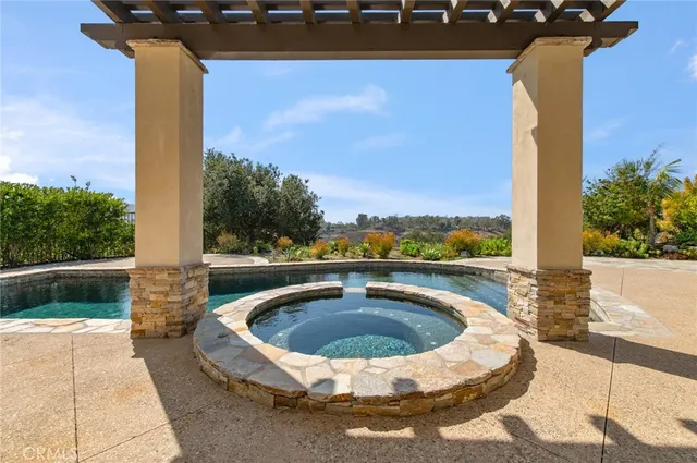 a view of a swimming pool with a yard