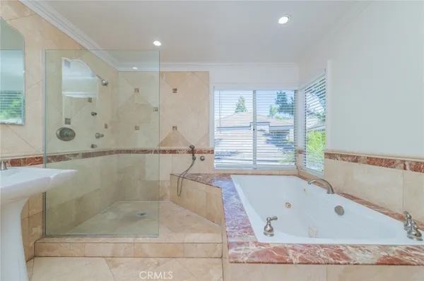 a bathroom with a bathtub and a shower