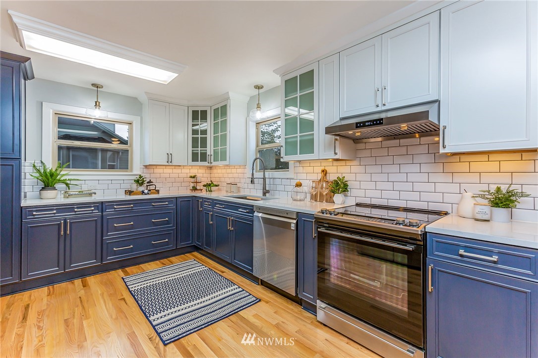 6009 Cady Road Everett, WA 98203 - Photo 11 of 40 a kitchen with granite countertop stainless steel appliances and wooden cabinets