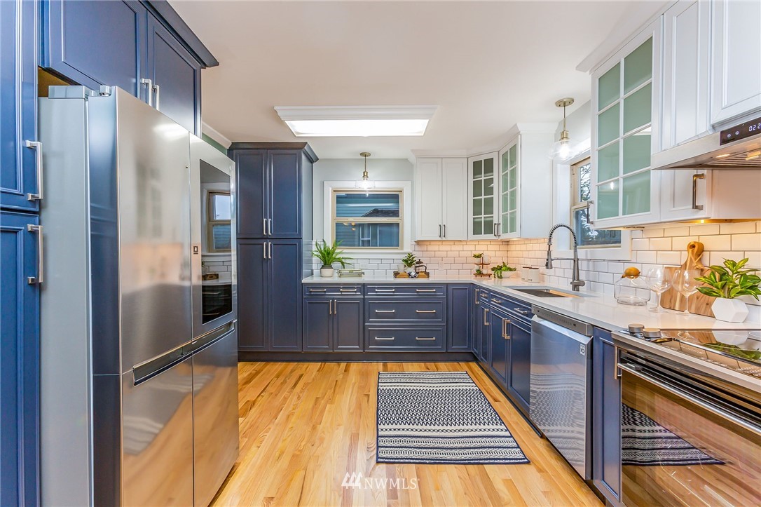 6009 Cady Road Everett, WA 98203 - Photo 12 of 40 a large kitchen with stainless steel appliances granite countertop a refrigerator and a sink