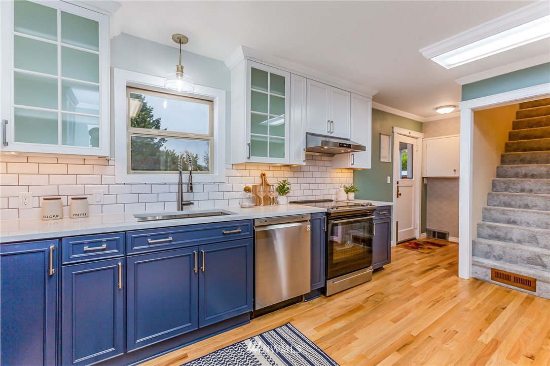 6009 Cady Road Everett, WA 98203 - Photo 13 of 40 a kitchen with stainless steel appliances granite countertop a stove and a sink