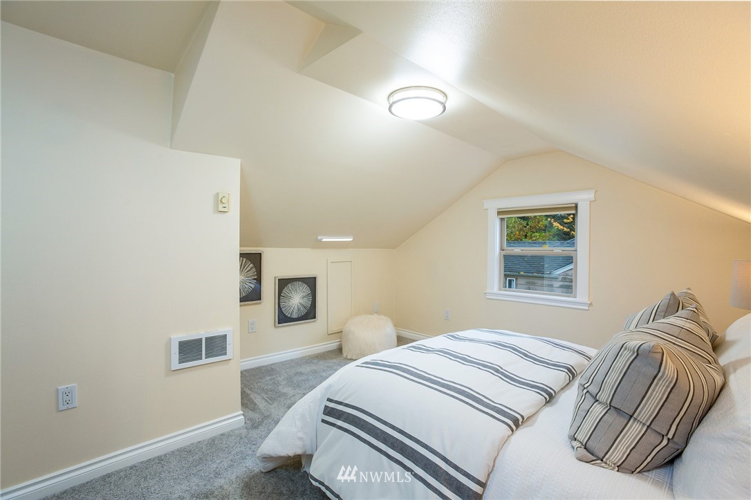 6009 Cady Road Everett, WA 98203 - Photo 25 of 40 a bedroom with a bed and a couch