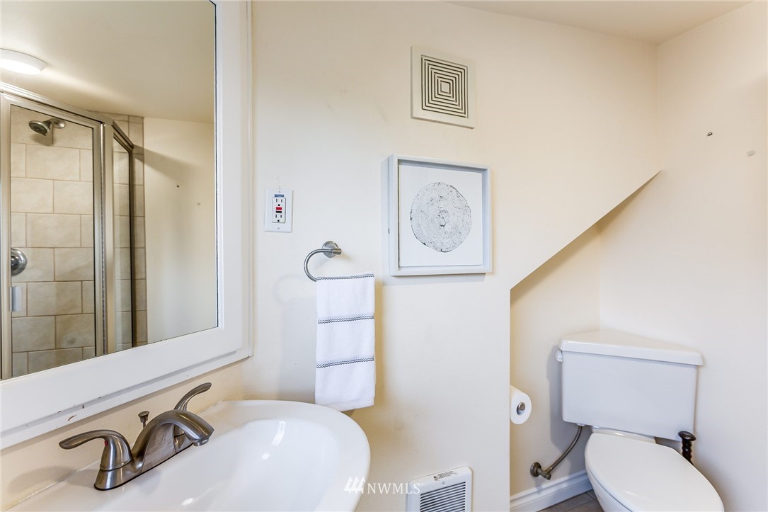 6009 Cady Road Everett, WA 98203 - Photo 28 of 40 a bathroom with a toilet sink and mirror