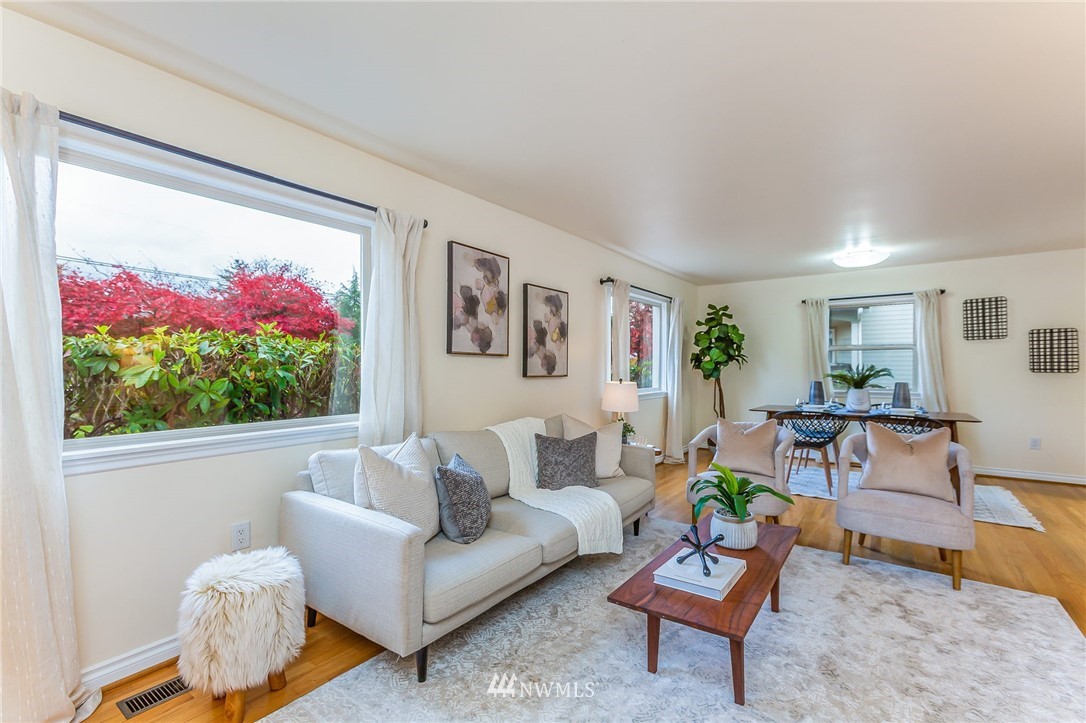 6009 Cady Road Everett, WA 98203 - Photo 6 of 40 a living room with furniture and a flat screen tv