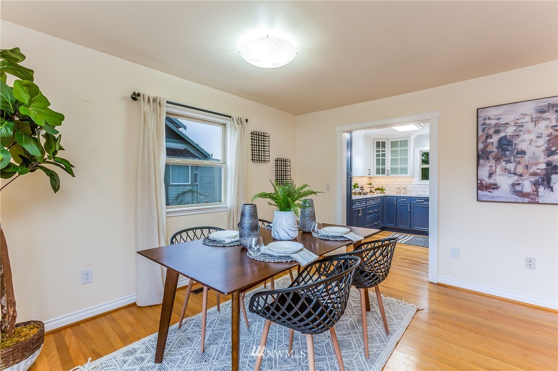 6009 Cady Road Everett, WA 98203 - Photo 9 of 40 a dining room with furniture and wooden floor