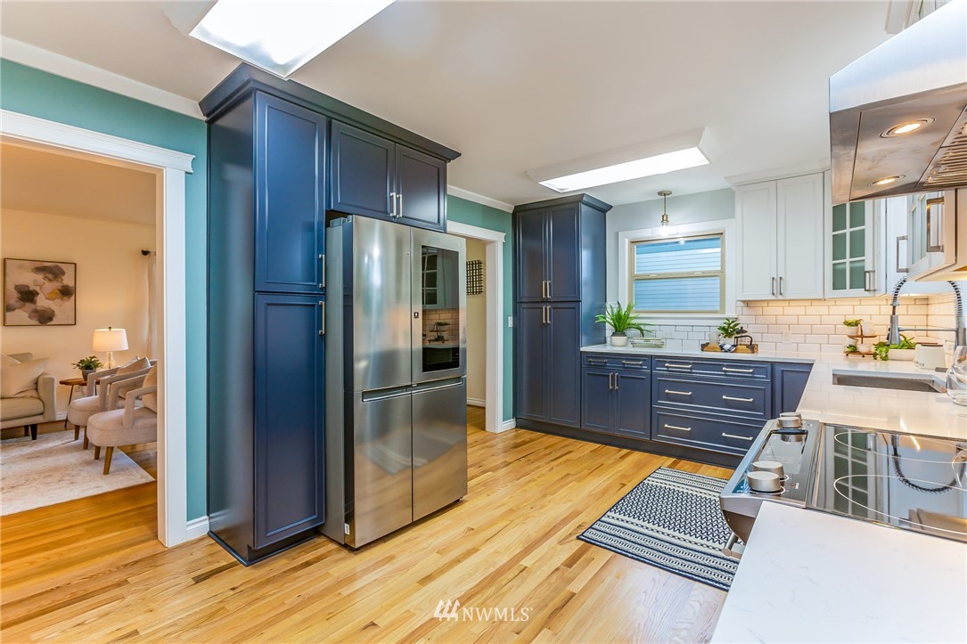 6009 Cady Road Everett, WA 98203 - Photo 10 of 40 a view of kitchen with stainless steel appliances granite countertop a refrigerator and a sink