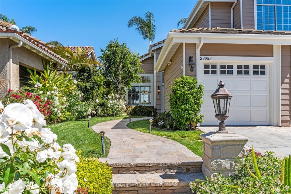 24882 Summerwind Dana Point, CA 92629 - Photo 2 of 31 front view of a house with a garden