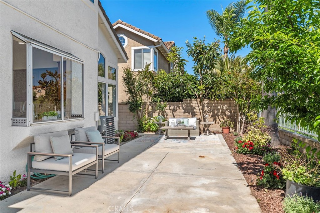 24882 Summerwind Dana Point, CA 92629 - Photo 23 of 31 a view of a patio with a table and chairs and potted plants