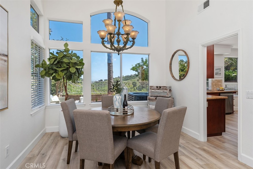 24882 Summerwind Dana Point, CA 92629 - Photo 5 of 31 a view of a dining room with furniture window and wooden floor