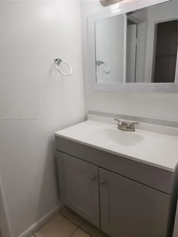a white toilet sitting next to a bath tub