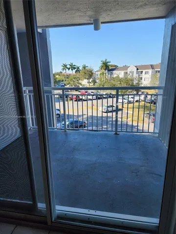 a view of balcony with furniture