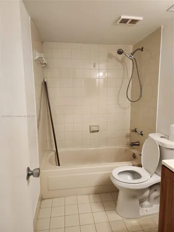 a bathroom with a sink vanity and a mirror