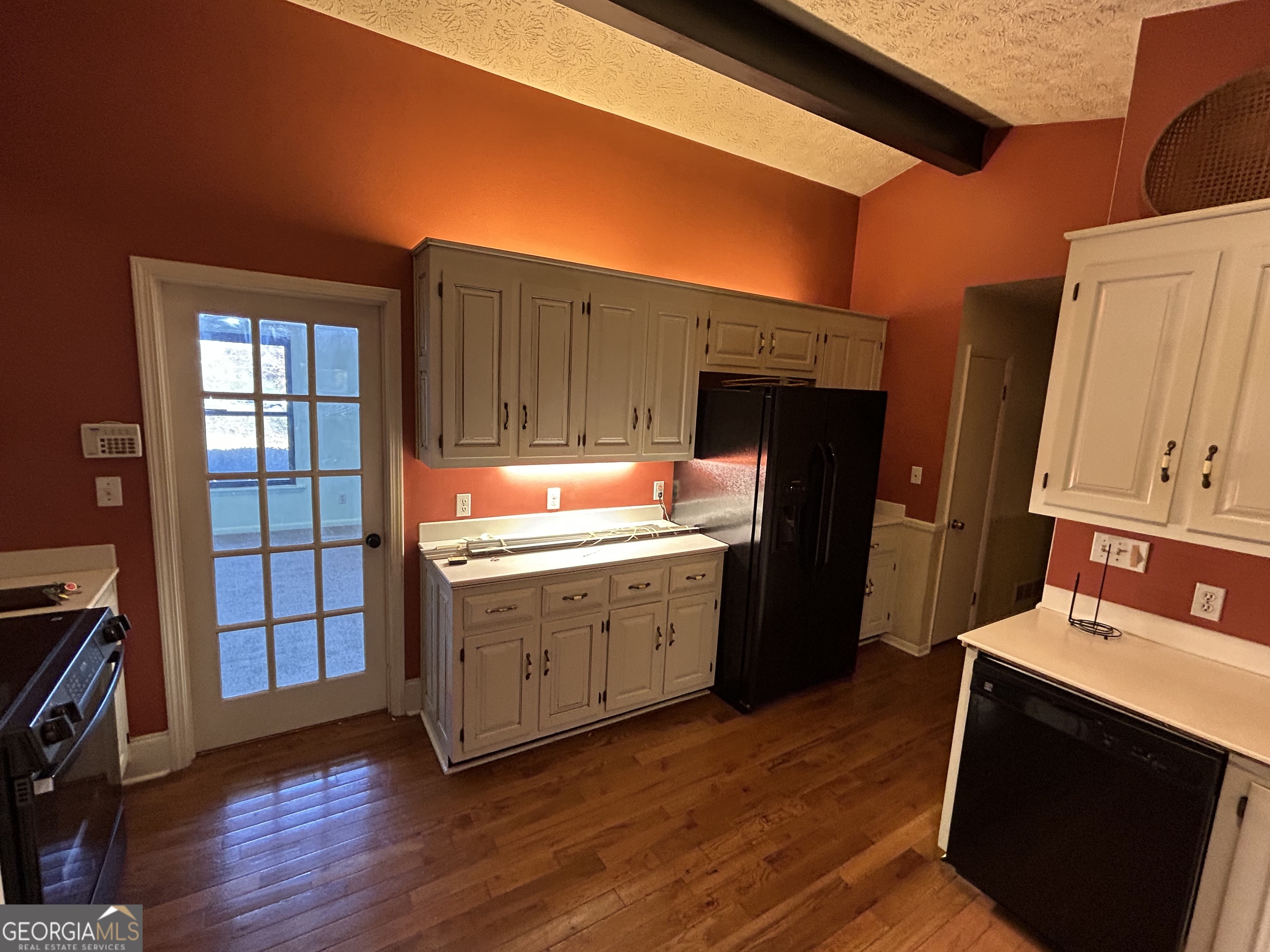 1595 Timothy Road Athens, GA 30606 - Photo 13 of 22 a kitchen with granite countertop a refrigerator stove and wooden floor