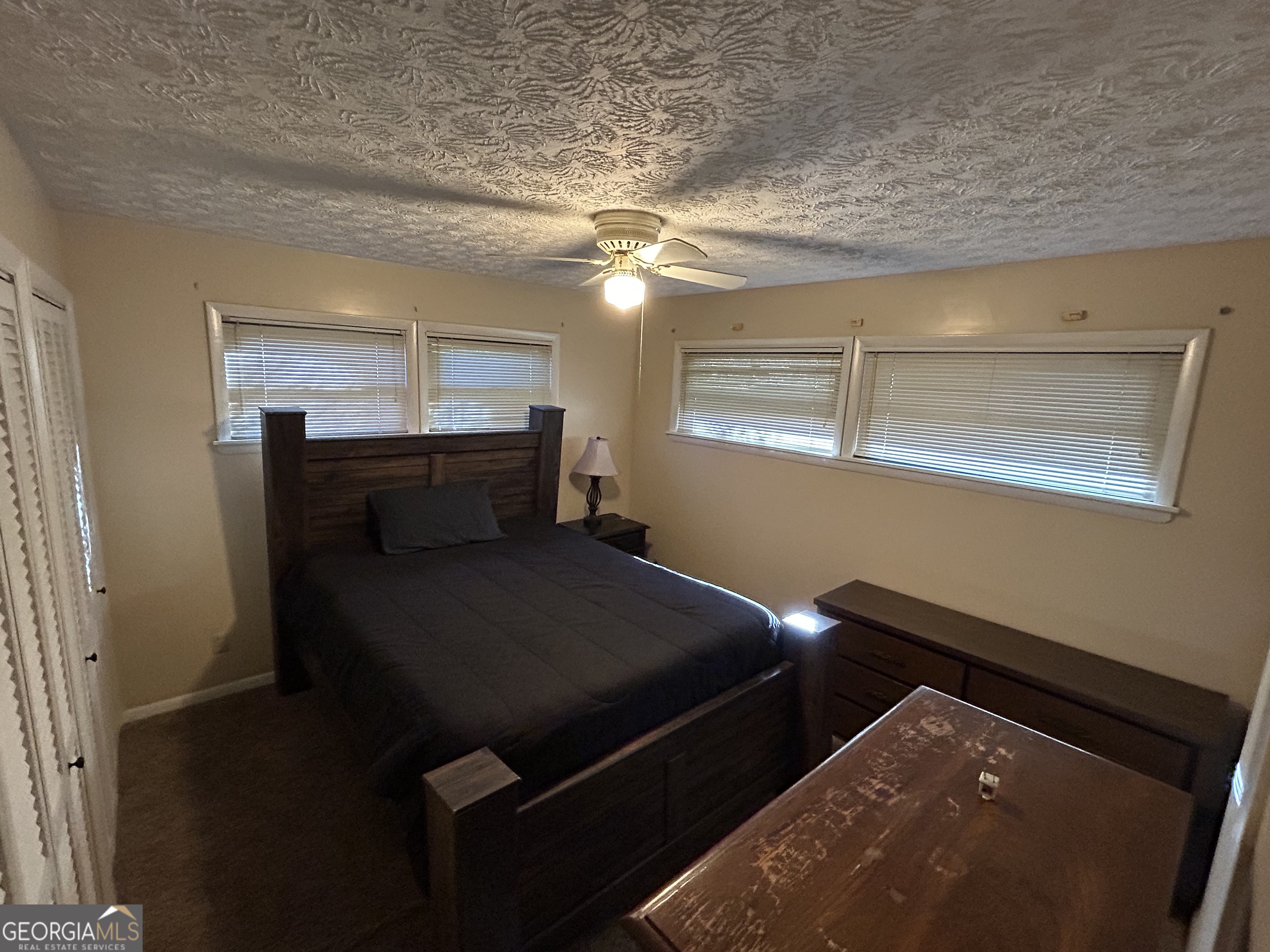 1595 Timothy Road Athens, GA 30606 - Photo 15 of 22 a bedroom with a bed and a chandelier