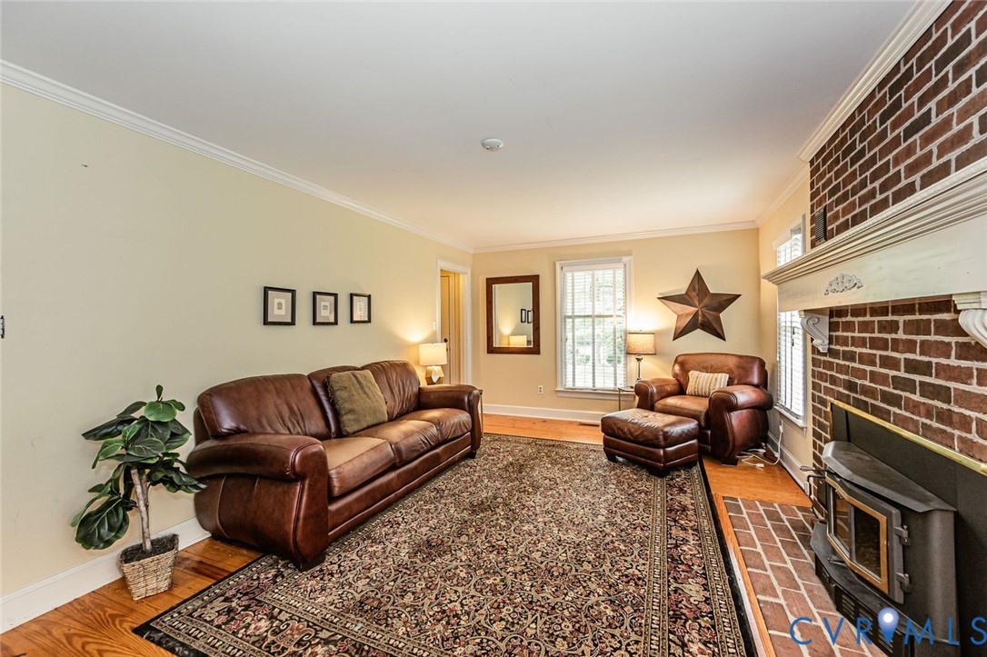 7300 Old Roxbury Road Quinton, VA 23141 - Photo 20 of 89 Warm and inviting living room featuring a brick fi