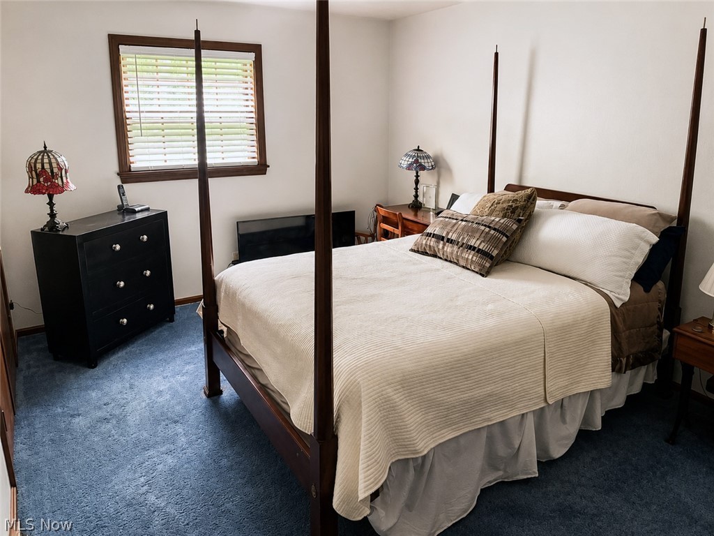 6155 Gibson Road Canfield, OH 44406 - Photo 31 of 43 Carpeted room featuring a window with wood trim and blinds