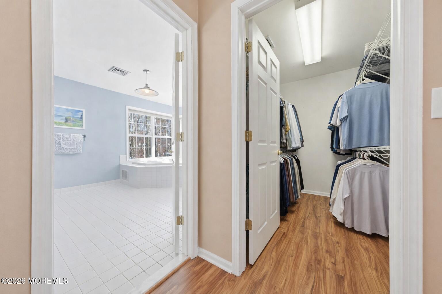 17 Amanda Lane Howell, NJ 07731 - Photo 21 of 35 a view of hallway with wooden floor and stairs